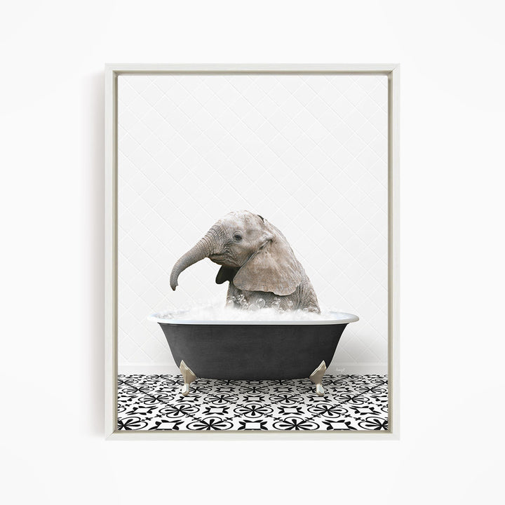 A baby elephant sitting in a bathtub filled with water, surrounded by a black and white patterned floor.