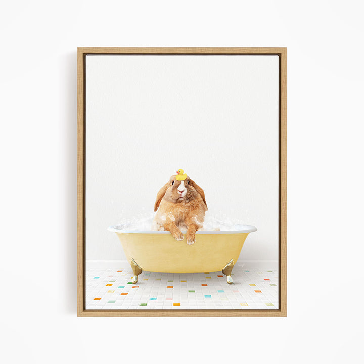 A brown rabbit sitting in a yellow bathtub filled with bubbles, wearing a yellow hat.