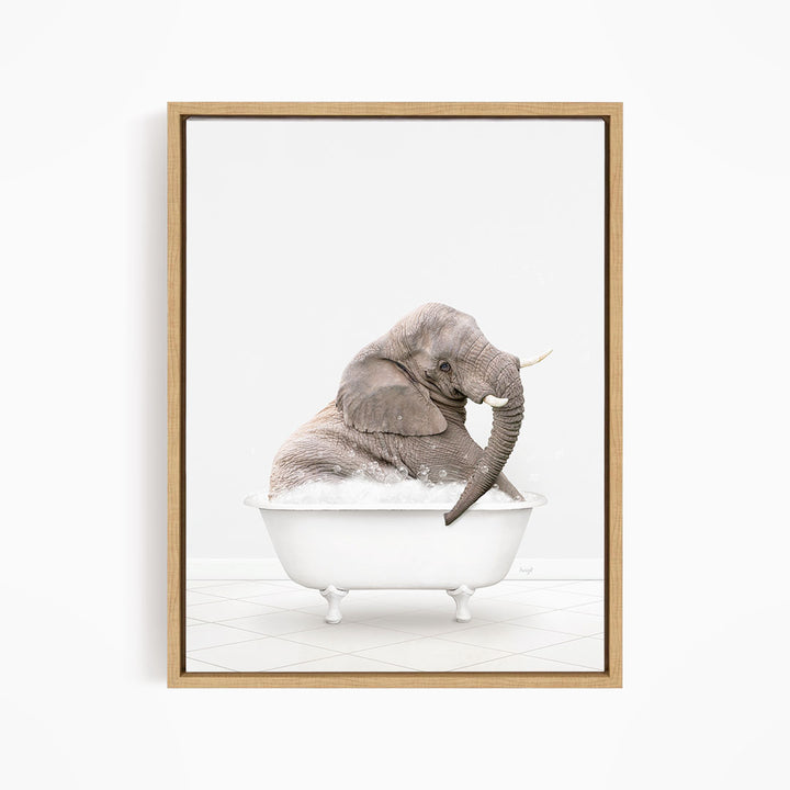 A gray elephant sitting in a white bathtub filled with bubbles, creating a whimsical and playful scene.