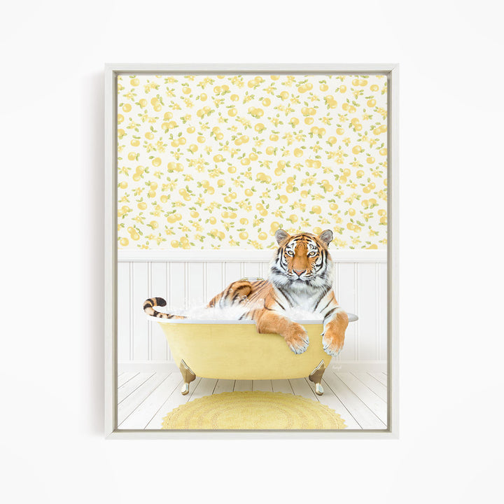 A tiger is sitting in a yellow bathtub, surrounded by a yellow and white floral patterned wall.