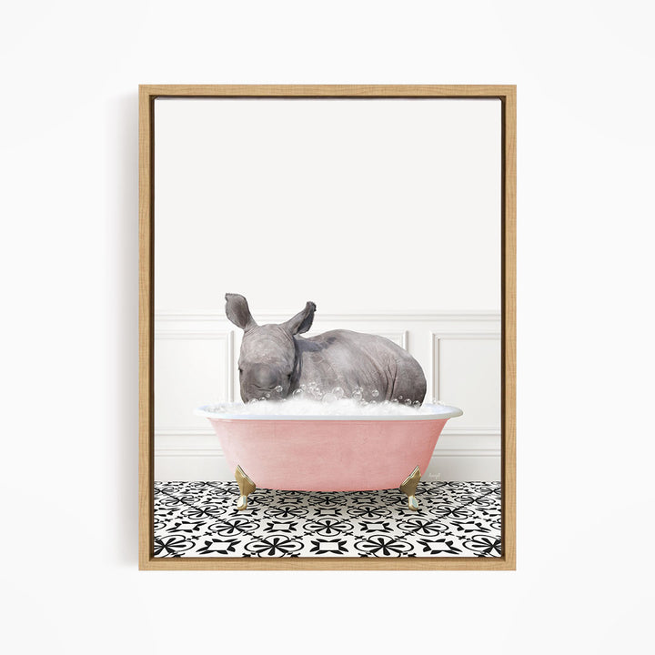 A rhinoceros is sitting in a pink bathtub filled with water, surrounded by a black and white patterned floor.
