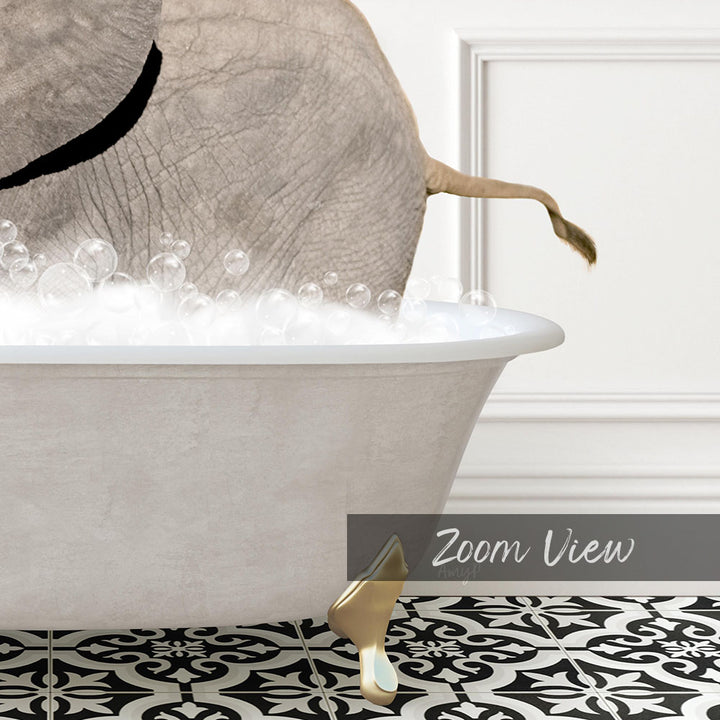 A white bathtub filled with bubbles, with a gold faucet and a gold bathtub stopper, and a gold bathtub foot visible.