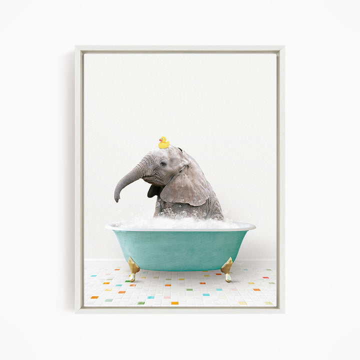 A gray elephant is sitting in a green bathtub, with a yellow rubber duck perched on its head.