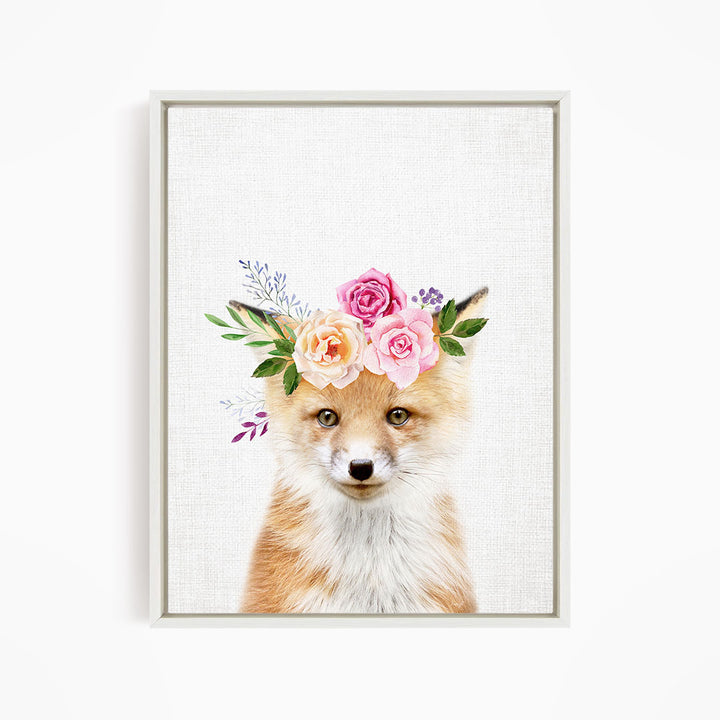 A fox wearing a floral crown of pink and orange roses and green leaves.