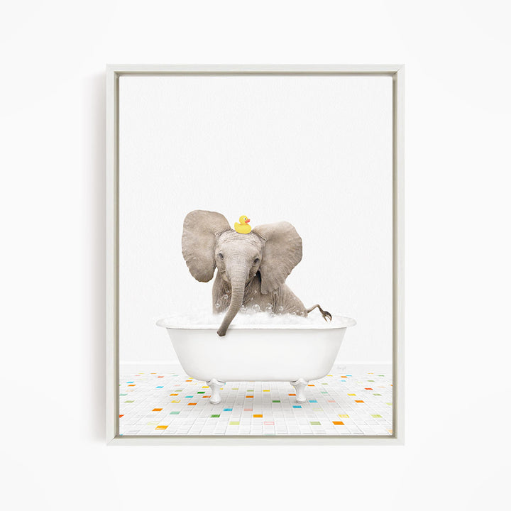 A baby elephant sitting in a white bathtub, with a yellow rubber duck floating on its head.