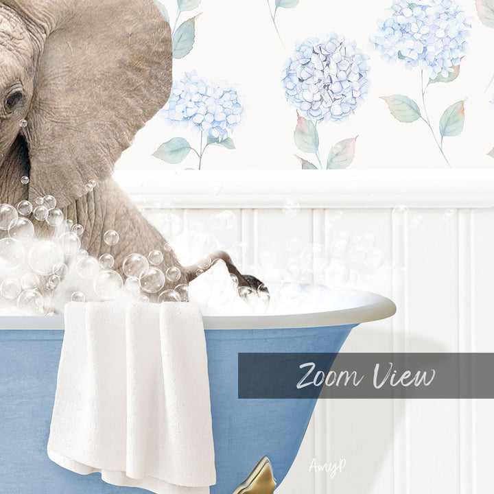 A large elephant is taking a bath in a blue bathtub, surrounded by bubbles and a towel, with a floral wallpaper in the background.