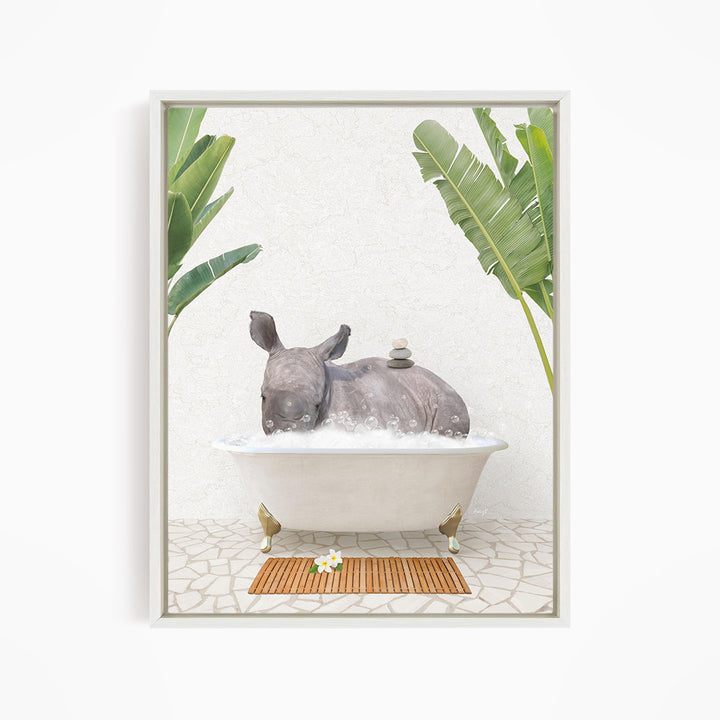 A rhinoceros is sitting in a bathtub filled with water, surrounded by tropical plants and a wooden mat on the floor.
