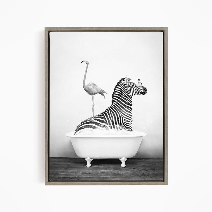 A zebra is sitting in a bathtub, with a flamingo standing on its back legs and a bird perched on its head.