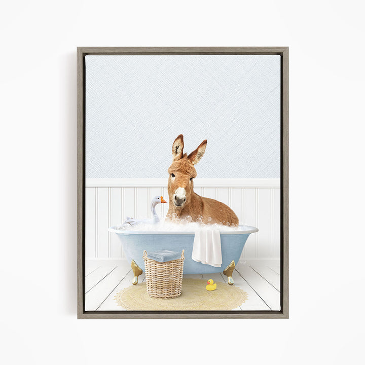 A donkey is sitting in a blue bathtub filled with bubbles, surrounded by rubber ducks and a basket.
