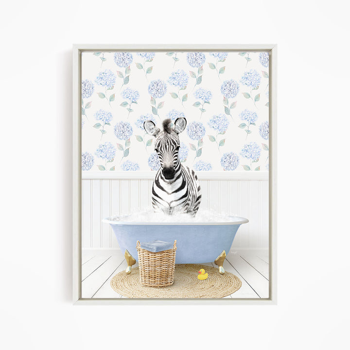 A zebra standing in a blue bathtub filled with water, surrounded by a wicker basket and yellow rubber ducks.