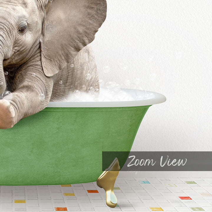 A baby elephant sitting in a green bathtub filled with bubbles, with a text overlay that reads "Zoom View".