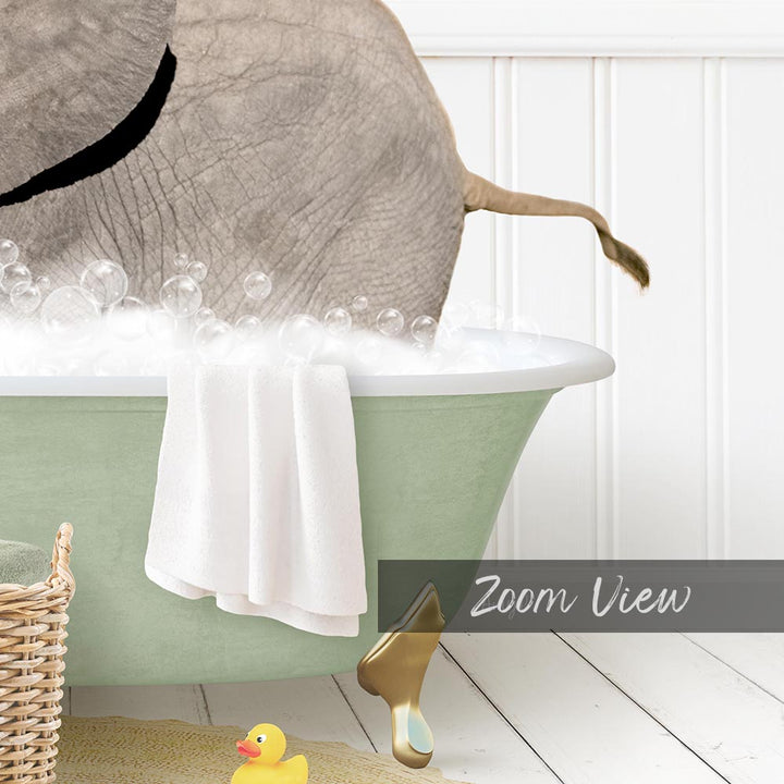 A bathtub filled with bubbles, with a towel hanging on the side and a rubber duck nearby.