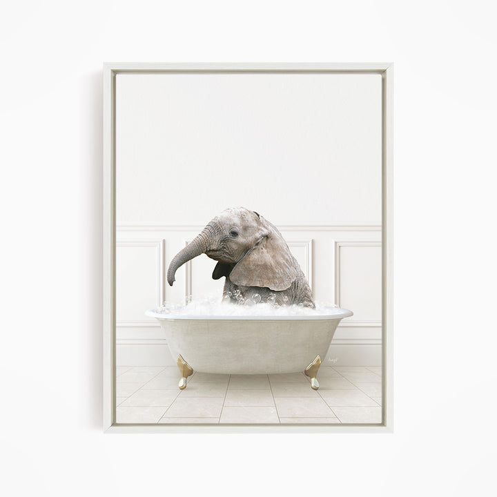 A baby elephant sitting in a white bathtub filled with water, appearing to enjoy the bath.