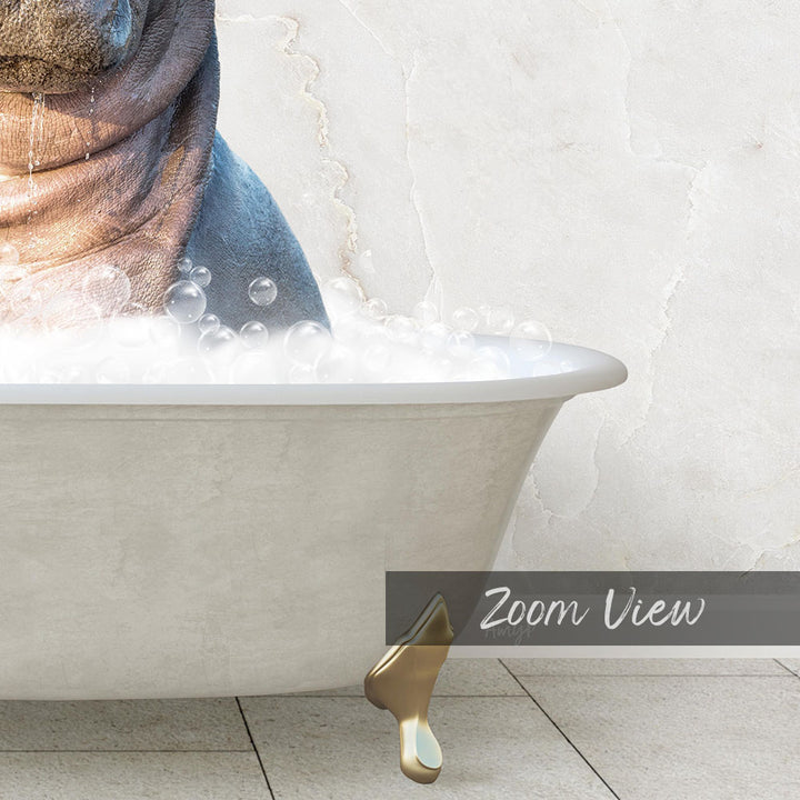 A bathtub filled with bubbles, with a gold bathtub faucet and a gold bathtub leg visible.