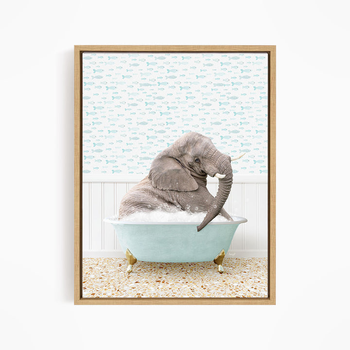 A gray elephant is sitting in a light blue bathtub filled with water, surrounded by a patterned wall and a tiled floor.