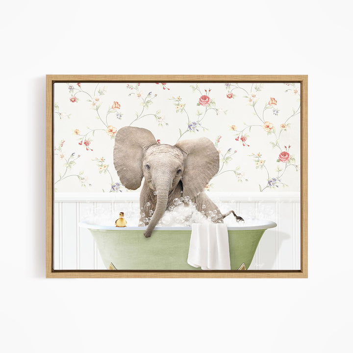 A gray elephant is sitting in a green bathtub filled with water, surrounded by a floral wallpaper.