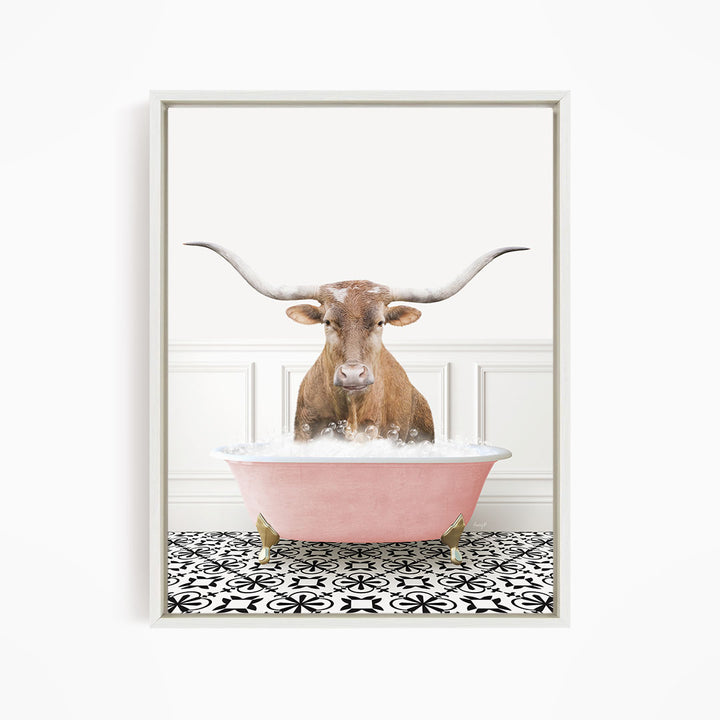 A brown bull with large horns is sitting in a pink bathtub filled with bubbles, creating a whimsical and playful scene.
