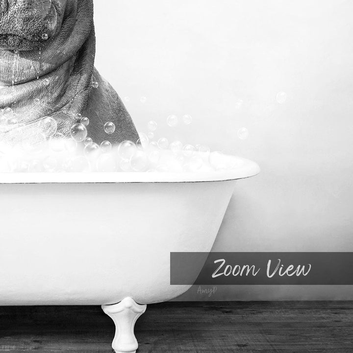 A black and white image of a bathtub filled with bubbles, with a person's head partially submerged in the water.