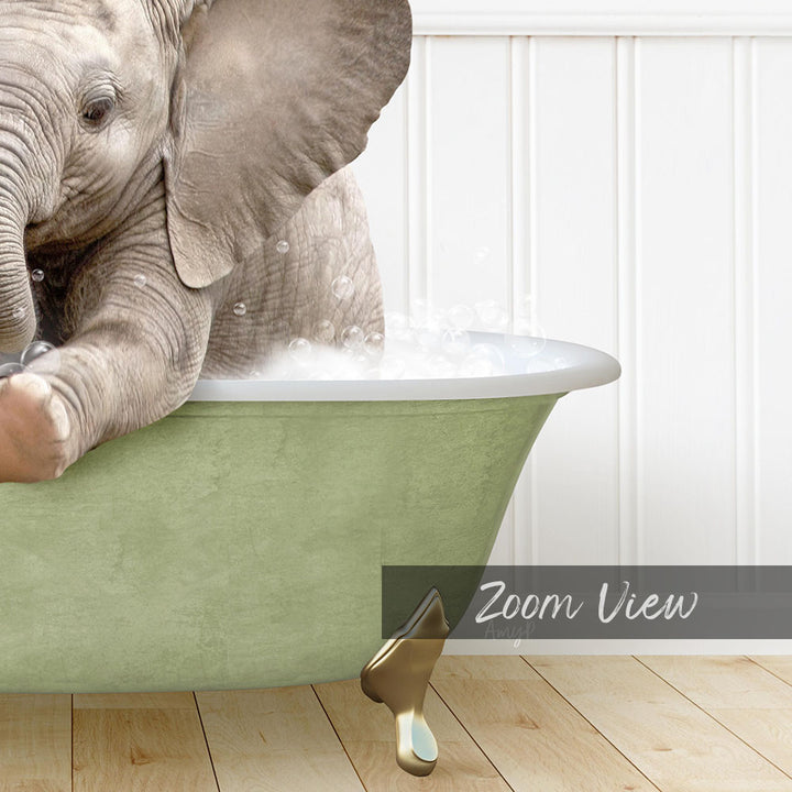 A baby elephant sitting in a green bathtub filled with water, with bubbles around it.