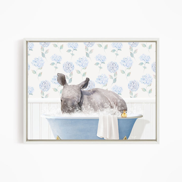 A rhinoceros is sitting in a blue bathtub filled with water, surrounded by blue flowers on the wall behind it.