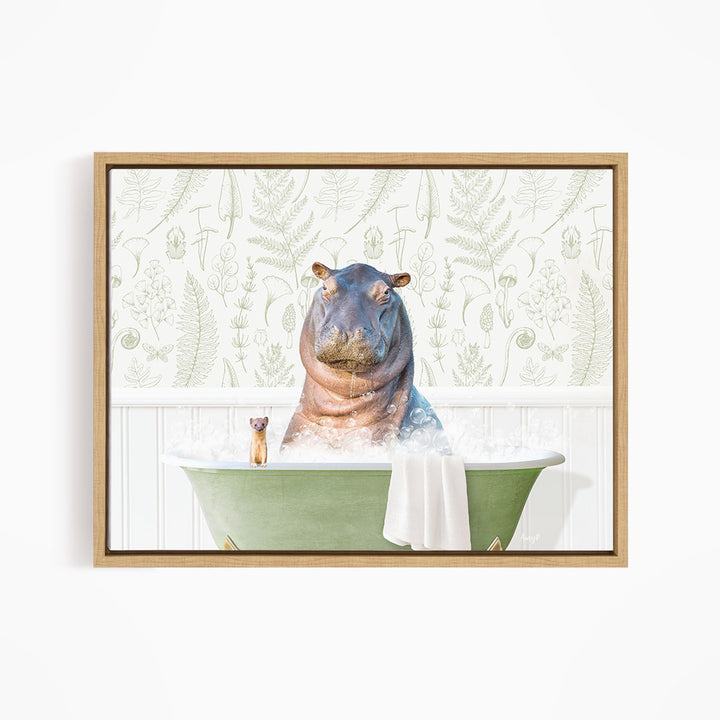 A framed image depicting a hippopotamus sitting in a bathtub, with a small cat sitting on the edge of the tub.