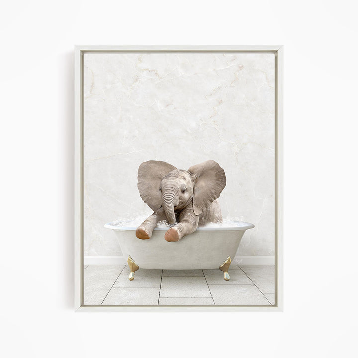 A baby elephant sitting in a white bathtub filled with water, with its trunk submerged in the water.