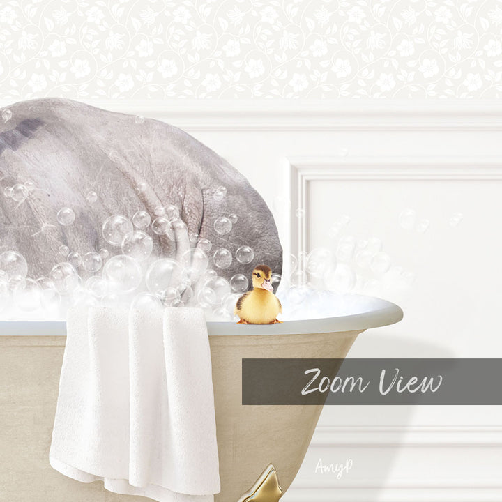 A gray elephant is sitting in a bathtub filled with bubbles, with a yellow duck sitting on the edge of the tub.