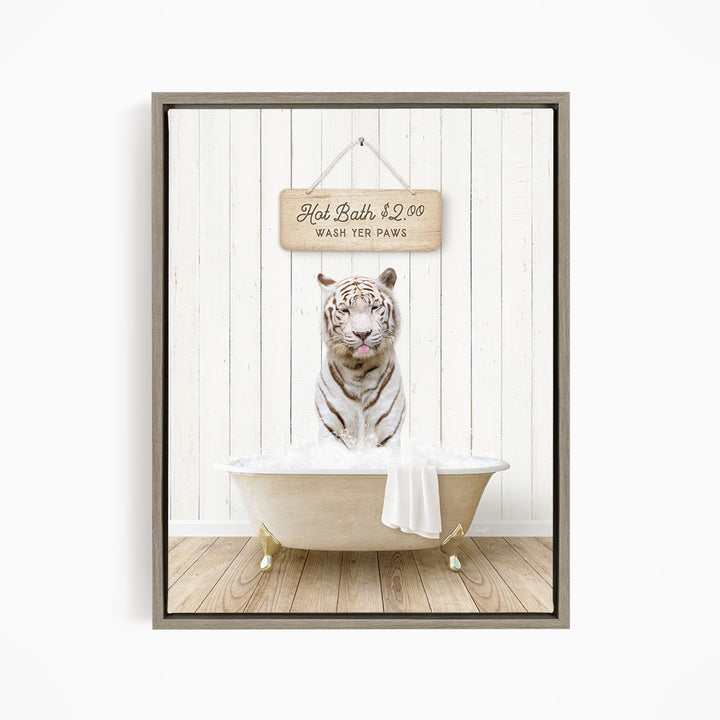 A white tiger sitting in a bathtub, with a sign above it that says "Hot Bath $2.00 Wash Your Paws".