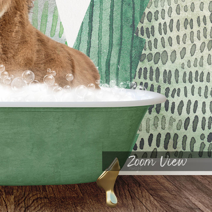A cat sitting in a green bathtub filled with bubbles, with a patterned wall in the background.
