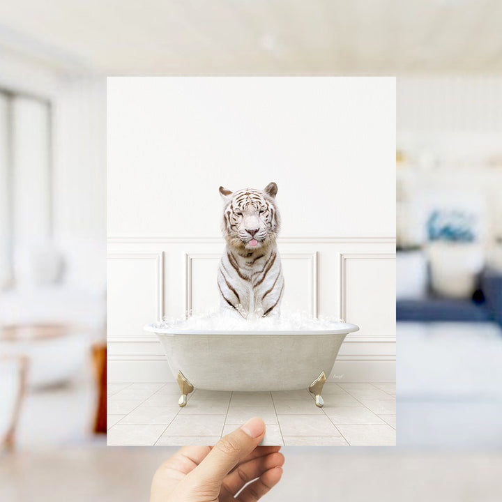 A white tiger sitting in a bathtub filled with water, with a blurred background suggesting a bathroom setting.