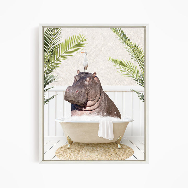 A framed image depicting a hippopotamus sitting in a bathtub, with a bird perched on its head.