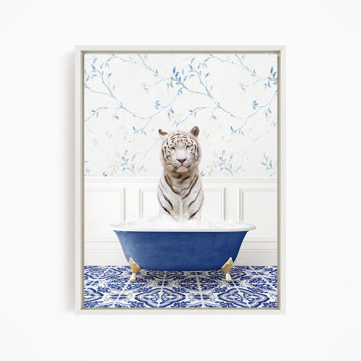 A white tiger is sitting in a blue bathtub filled with water, surrounded by a blue and white patterned floor.