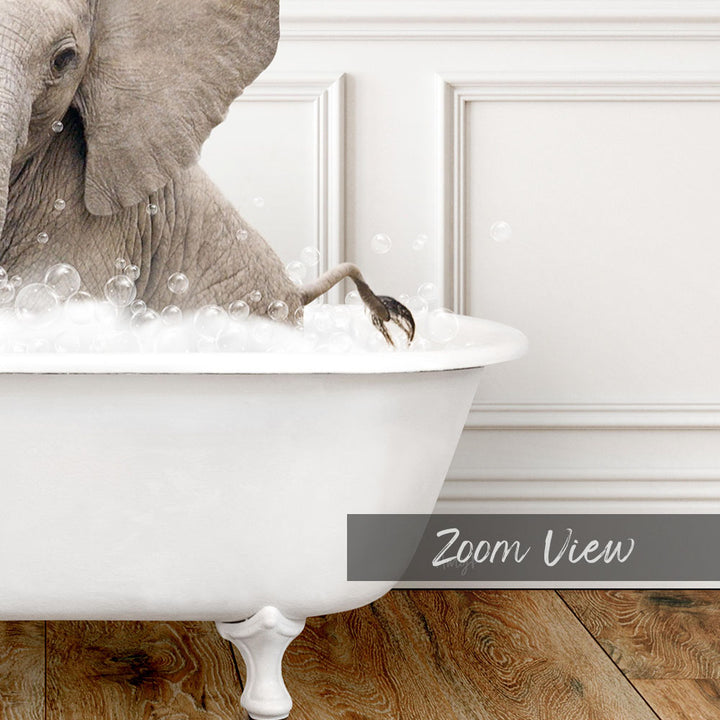 A large elephant is sitting in a white bathtub filled with bubbles, creating a whimsical and playful scene.