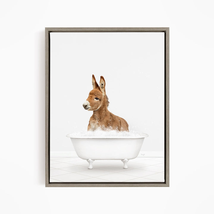 A donkey is sitting in a white bathtub filled with water, creating a playful and whimsical scene.