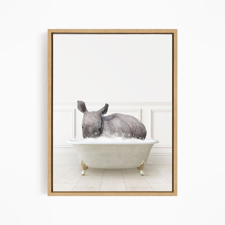 A rhinoceros is sitting in a white bathtub filled with water, creating a whimsical and playful scene.