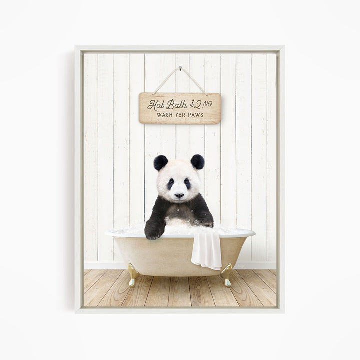 A panda bear sitting in a bathtub, with a sign above that reads "Hot Bath $2.00 WASH YOUR Paws".
