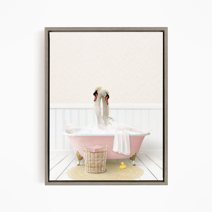 A pair of swans sitting in a pink bathtub filled with bubbles, surrounded by a yellow rubber duck and a wicker basket.