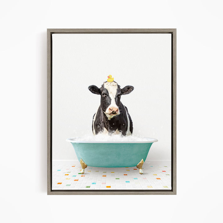 A black and white cow is standing in a green bathtub filled with water, with a yellow rubber duck perched on its head.