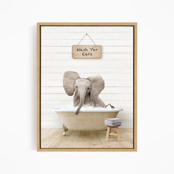 A gray elephant sitting in a bathtub, with a sign above it that says "Wash Your Ears".