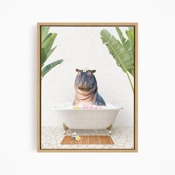 A framed image depicting a hippopotamus sitting in a bathtub filled with bubbles, surrounded by tropical plants and a wooden mat.