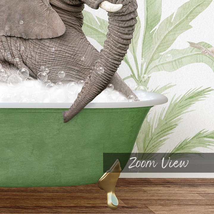 A large elephant is sitting in a green bathtub filled with bubbles, surrounded by palm leaves and a wooden floor.