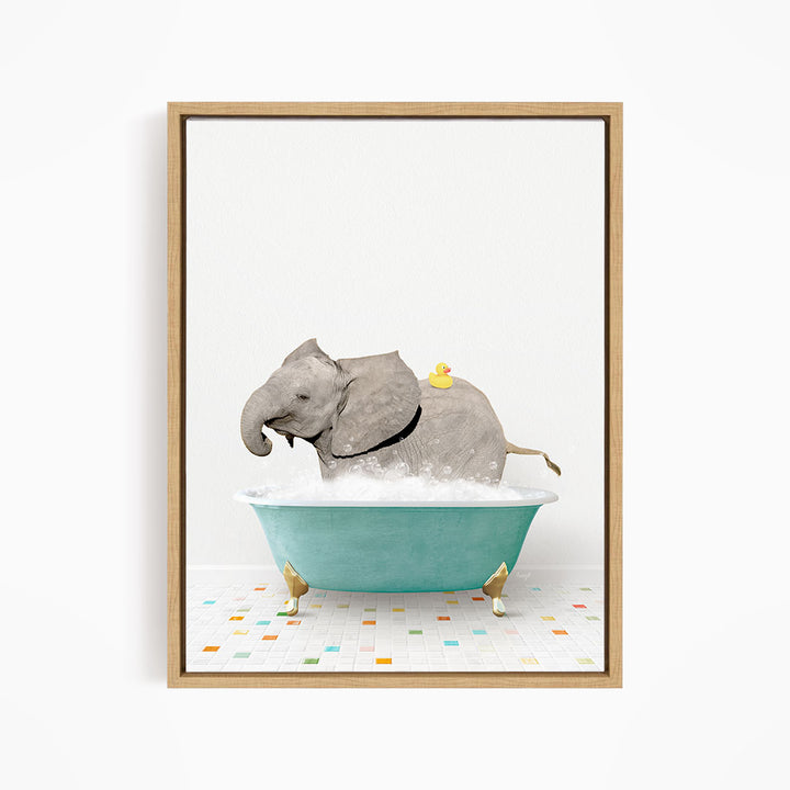 A gray elephant is sitting in a blue bathtub filled with water, with a yellow rubber duck floating on its back.