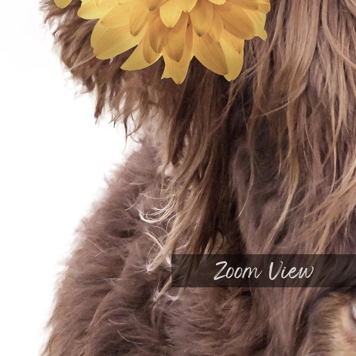 a close up of a dog with a flower in its mouth