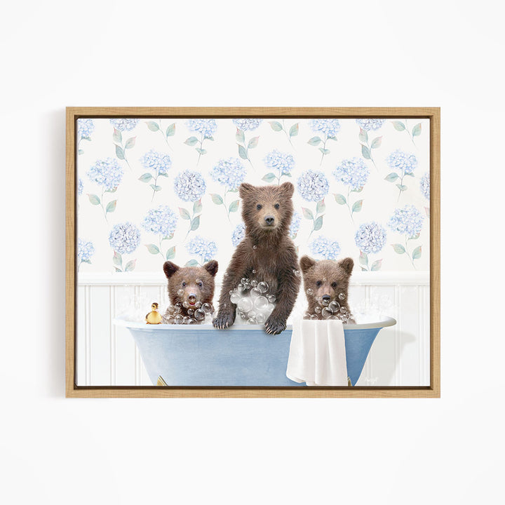 Three adorable brown bears enjoying a relaxing bath in a blue tub, surrounded by a floral patterned wall.