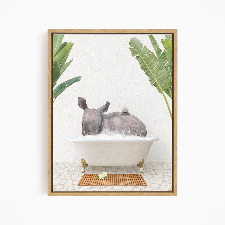 A rhinoceros is sitting in a bathtub filled with water, surrounded by tropical plants and a wooden mat on the floor.
