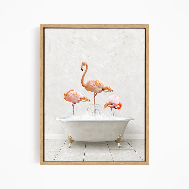 A framed image depicting three pink flamingos standing in a white bathtub filled with water.