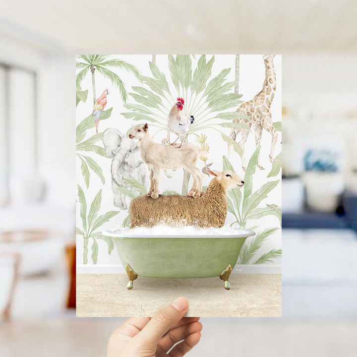 A hand holds up a framed print featuring a whimsical scene of animals, including a dog, cat, and bird, standing on a bathtub filled with water and surrounded by tropical foliage.
