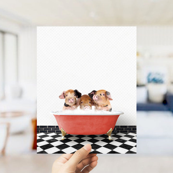 Three adorable pigs sitting in a red bathtub on a black and white checkered floor.