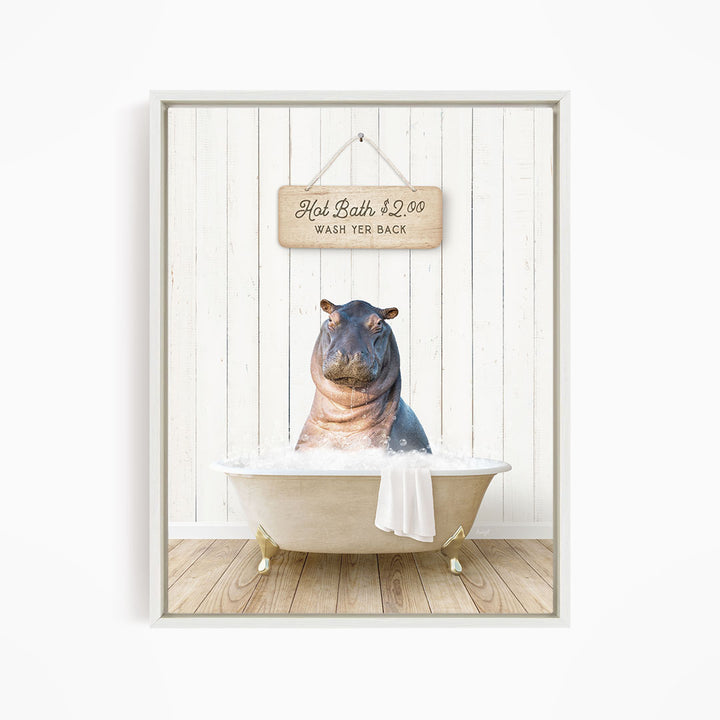 A framed image of a hippopotamus sitting in a bathtub, with a wooden sign above it that reads "Hot Bath $2.00 WASH YER BACK".