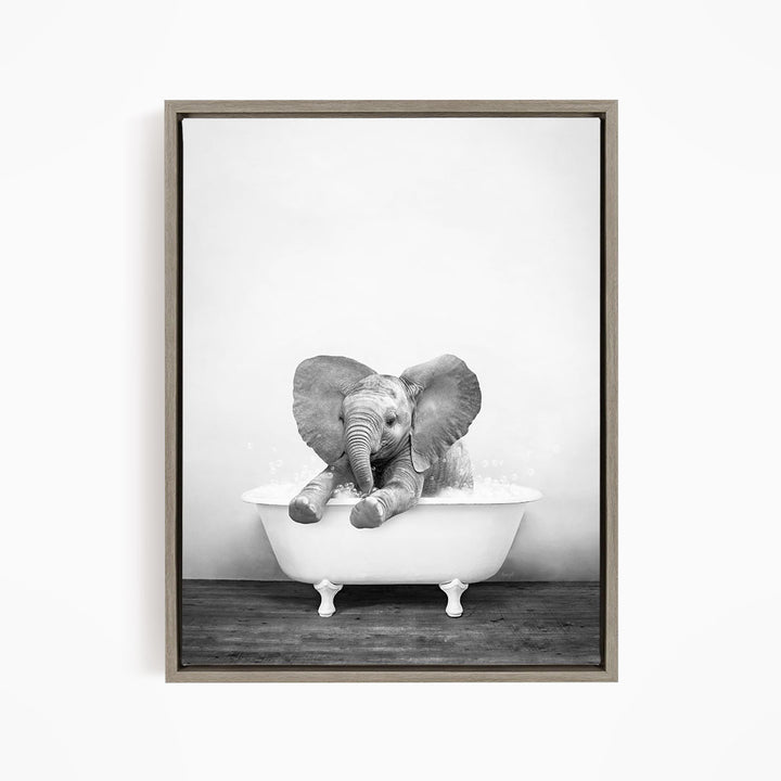 A baby elephant sitting in a bathtub filled with water, creating a playful and whimsical scene.